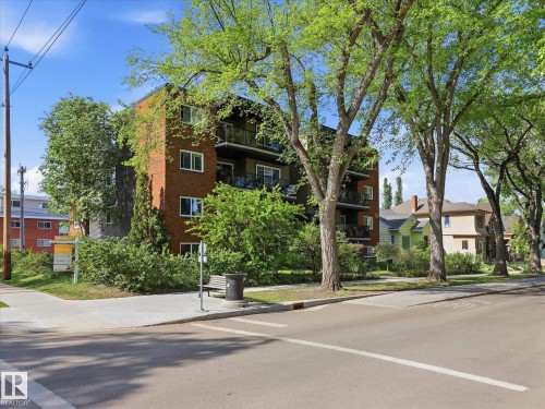 Multi-story residential building featuring a brick facade and multiple private balconies - 301 10003 87 Avenue, Edmonton, AB - Outdoor