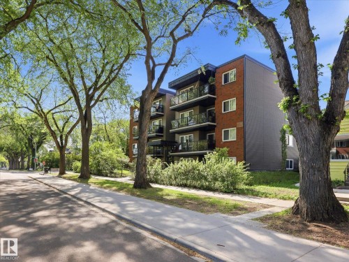 Multi-story building featuring brick and grey paneling facade - 301 10003 87 Avenue, Edmonton, AB - Outdoor