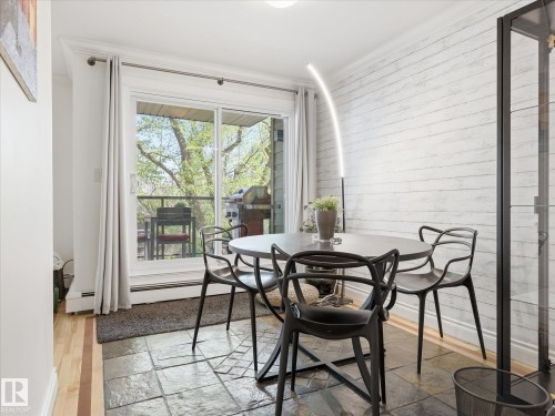 Sliding glass doors opening to a private balcony - 301 10003 87 Avenue, Edmonton, AB - Indoor Photo Showing Other Room