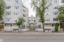 Building exterior featuring an arched main entrance, multiple windows, and a subterranean parking entrance - 202 10939 82 Avenue, Edmonton, AB 