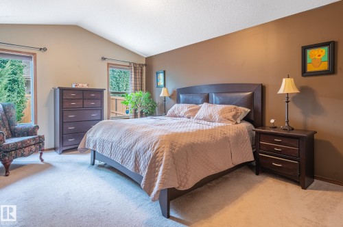 Carpeted room featuring an angled ceiling and dual windows - 19 Newton Place, St. Albert, AB - Indoor Photo Showing Bedroom