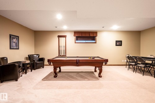 Spacious lower-level room featuring light-toned carpeting and recessed lighting - 19 Newton Place, St. Albert, AB - Indoor Photo Showing Other Room