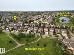 Aerial overview showcasing the property within a developed residential area - 