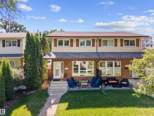 Brick and siding facade with a gabled roofline and shutters - 10940 123 Street, Edmonton, AB 