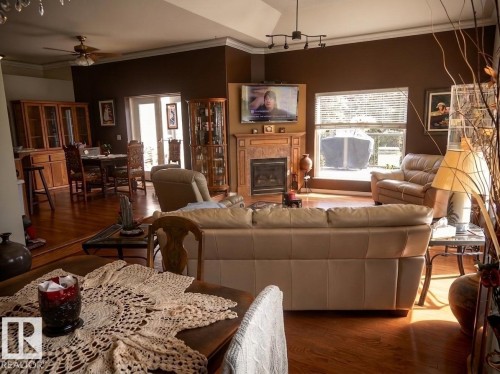 #9 Pinebrook Estates, Rural Thorhild County, AB - Indoor Photo Showing Living Room With Fireplace