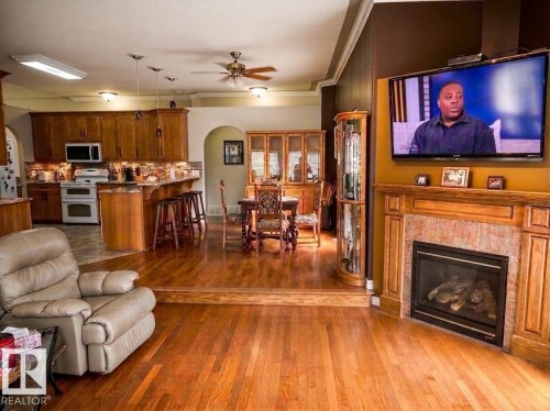 #9 Pinebrook Estates, Rural Thorhild County, AB - Indoor Photo Showing Living Room With Fireplace