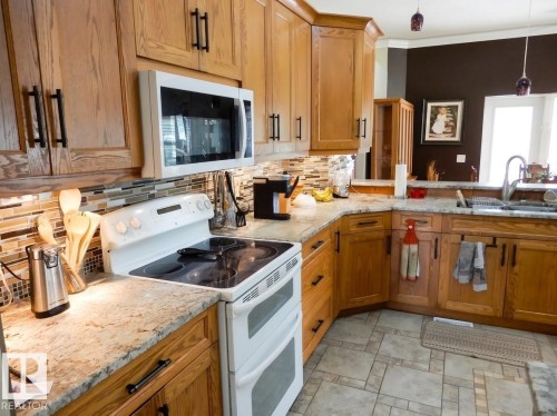 #9 Pinebrook Estates, Rural Thorhild County, AB - Indoor Photo Showing Kitchen With Double Sink
