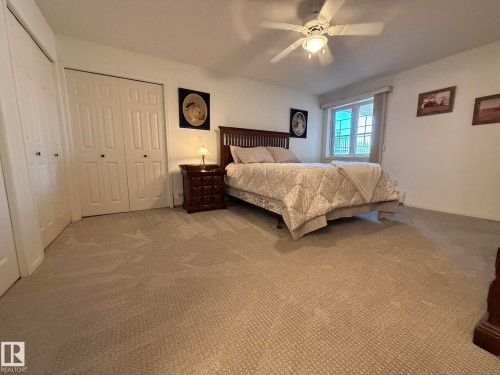 ANOTHER PHOTO OF THE PRIMARY BEDROOM WITH THE 3-SEPARATE CLOSETS ON THE LEFT! - 102 10903 21 Avenue, Edmonton, AB - Indoor Photo Showing Bedroom