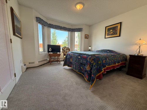 PHOTO OF THE 2nd BEDROOM LOCATED ON THE OPPOSITE SIDE OF THE UNIT BESIDE THE FULL 4pc BATHROOM! - 102 10903 21 Avenue, Edmonton, AB - Indoor Photo Showing Bedroom