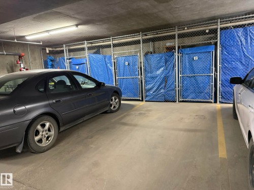 PHOTO OF YOUR UNDERGROUND #2 PARKING STALL WITH A LOCKABLE 4x8 STORAGE CAGE! - 102 10903 21 Avenue, Edmonton, AB - Indoor Photo Showing Garage