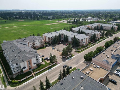 Expansive residential complex featuring multiple buildings with gabled roofs and private balconies - 102 10903 21 Avenue, Edmonton, AB - Outdoor With View