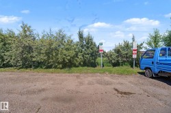 VISITOR PARKING AREA at the back of the building along the fenced area - 