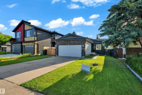 Traditional exterior with stone accents and an attached garage - 1316 35 Street, Edmonton, AB 