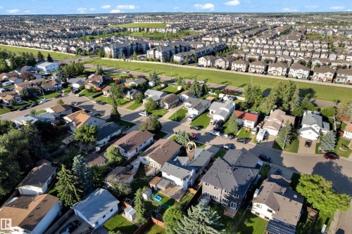 Aerial perspective showcasing a residential neighborhood with diverse housing styles, including single-story and multi-level properties - 1316 35 Street, Edmonton, AB 