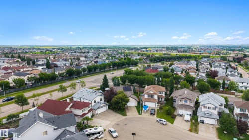 Residential neighborhood featuring single-family homes with pitched roofs and attached garages - 15227 47 Street, Edmonton, AB 