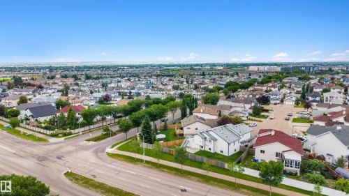 Expansive residential development featuring numerous single-family homes, mature tree-lined streets, and paved roadways - 15227 47 Street, Edmonton, AB 