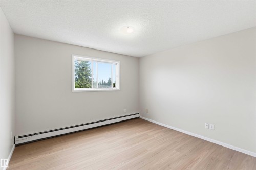 Bright interior space featuring light wood-finish flooring - #304 4924 19 Av Nw, Edmonton, AB 
