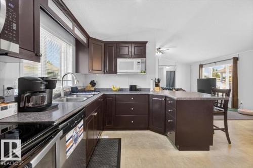 1073 Aspen Drive East, Leduc, AB - Indoor Photo Showing Kitchen With Double Sink