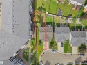 Aerial view showcasing a rectangular lot with mature trees and a grassy area - 16106 131A Street, Edmonton, AB 