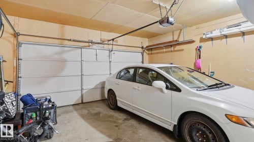 Attached two-car garage with overhead door opener and concrete flooring - 1225 Kane Wynd, Edmonton, AB 