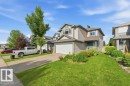 Two-story residence with light-colored siding and an attached garage - 2811 33 Street, Edmonton, AB 