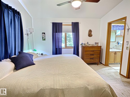 Bedroom featuring light-tone flooring and a ceiling fan - 171 Rhatigan Road, Edmonton, AB 