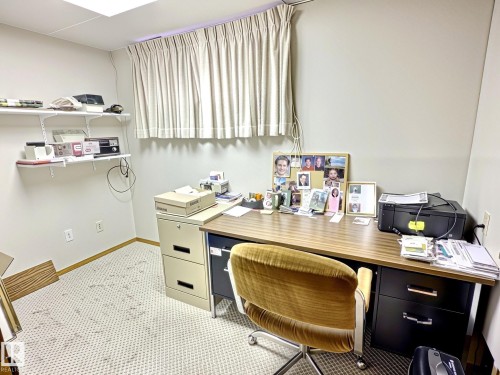 Functional room featuring white walls, a carpeted floor, recessed ceiling lighting, and a window with light-colored curtains - 171 Rhatigan Road, Edmonton, AB 