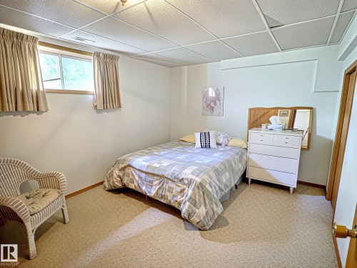 Carpeted room with a drop ceiling featuring recessed lighting - 171 Rhatigan Road, Edmonton, AB 