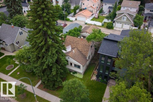 Modern multi-story property featuring a dark exterior facade and multiple vertical windows - 9026 92 Street Nw, Edmonton, AB - Outdoor