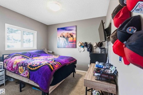 Room featuring neutral gray walls and light-colored carpeting - 24 6520 2 Avenue, Edmonton, AB 