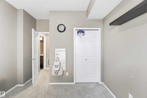 Light gray painted walls with white trim and carpeting - 24 6520 2 Avenue, Edmonton, AB 