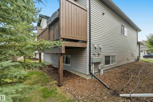 Elevated deck with brown wood railings - 24 6520 2 Avenue, Edmonton, AB 