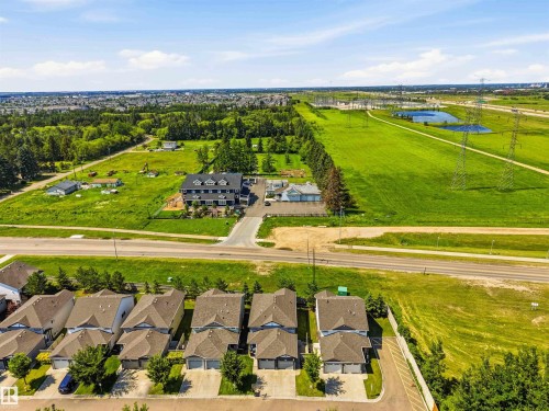 Aerial perspective showcasing residential properties and surrounding green spaces - 24 6520 2 Avenue, Edmonton, AB 