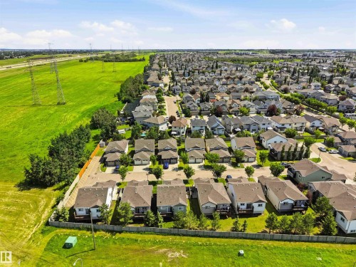 Aerial perspective showcasing a residential development bordered by open green spaces - 24 6520 2 Avenue, Edmonton, AB 