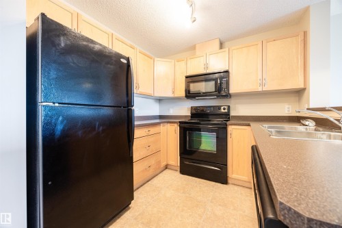 404 5951 165 Avenue, Edmonton, AB - Indoor Photo Showing Kitchen With Double Sink