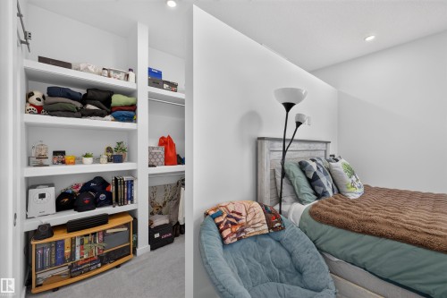 Integrated custom shelving and a built-in closet system provide storage solutions - 8551 81 Avenue, Edmonton, AB 