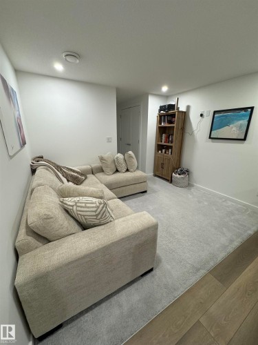 Room featuring light-colored walls and recessed ceiling lighting - 8551 81 Avenue, Edmonton, AB 
