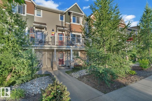 Contemporary townhome featuring multi-toned siding and architectural gables - 140 655 Tamarack Road, Edmonton, AB 
