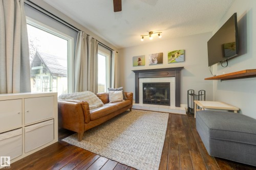 4810 42 Street, Beaumont, AB - Indoor Photo Showing Living Room With Fireplace