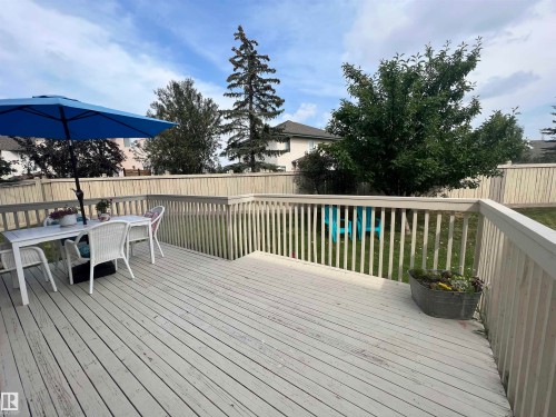Spacious exterior deck with white-painted railing and steps to the yard - 1417 115A Street, Edmonton, AB - Outdoor With Deck Patio Veranda