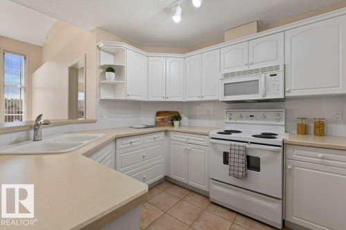 #412 9760 174 St Nw, Edmonton, AB - Indoor Photo Showing Kitchen With Double Sink