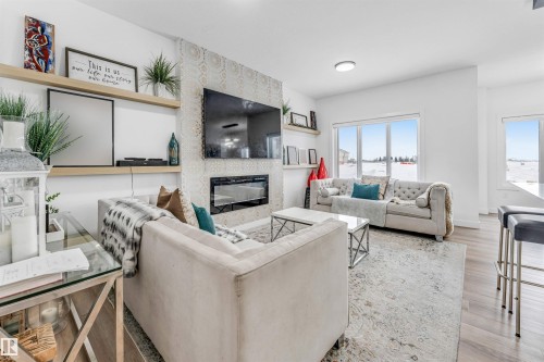 3807 40 Avenue, Beaumont, AB - Indoor Photo Showing Living Room With Fireplace