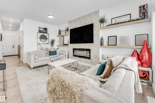 3807 40 Avenue, Beaumont, AB - Indoor Photo Showing Living Room With Fireplace