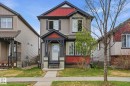 Two-story residence featuring siding and red accent panels - 445 Watt Boulevard, Edmonton, AB 