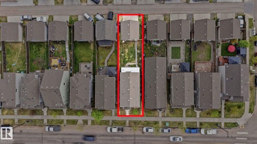 Property featuring a main residence and a detached auxiliary structure, both with gabled roofs - 445 Watt Boulevard, Edmonton, AB 