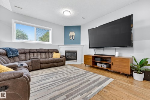 78 Bonin Crescent, Beaumont, AB - Indoor Photo Showing Living Room With Fireplace