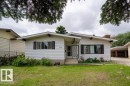 Single-story residence featuring white siding and a front lawn - 4224 89 Street, Edmonton, AB 