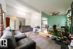 Open concept living area featuring wood-finish flooring - 