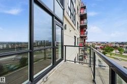 Private balcony featuring glass railings and tile flooring - 