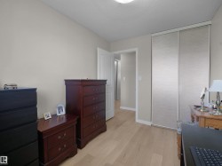 Light wood-finish flooring complements neutral wall paint in this room - 